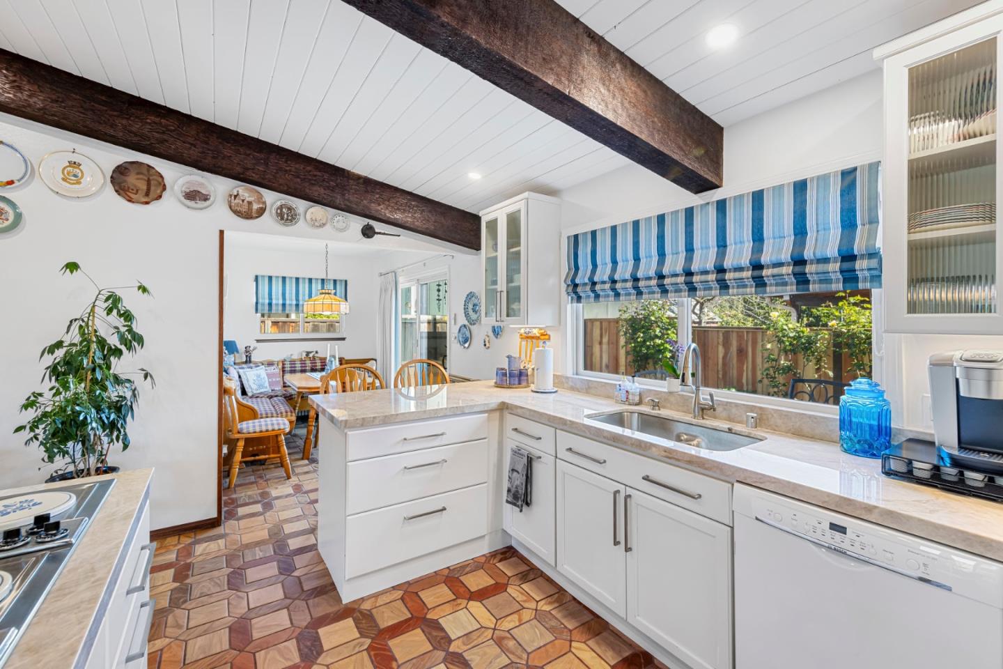 1272 Stardust Way Milpitas, CA 95035 - Photo 18 of 61 a kitchen that has a lot of cabinets in it and wooden floor