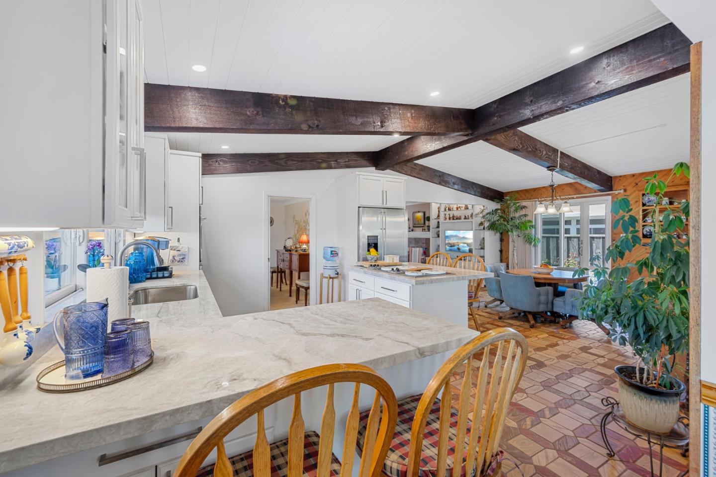 1272 Stardust Way Milpitas, CA 95035 - Photo 20 of 61 a kitchen with sink refrigerator dining table and chairs