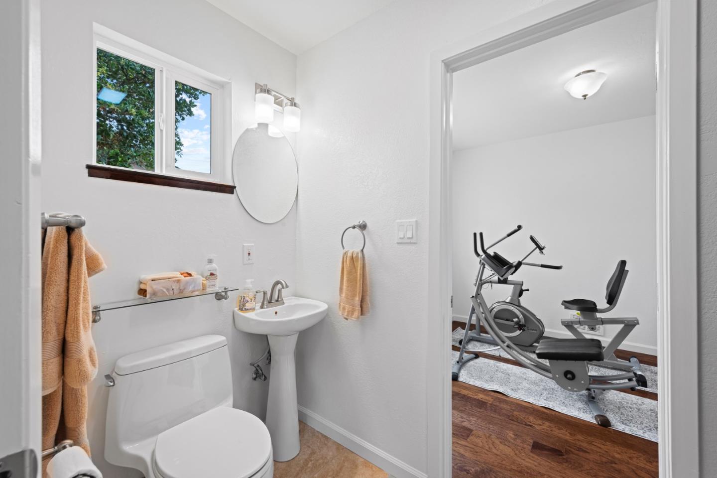 1272 Stardust Way Milpitas, CA 95035 - Photo 32 of 61 a bathroom with a toilet sink and mirror