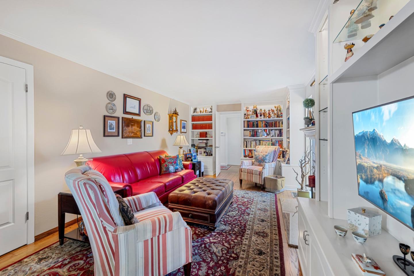 1272 Stardust Way Milpitas, CA 95035 - Photo 33 of 61 a living room with furniture and a book shelf