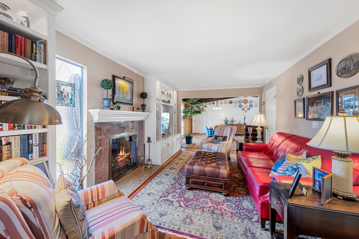 1272 Stardust Way Milpitas, CA 95035 - Photo 34 of 61 a living room with furniture a flat screen tv and a fireplace