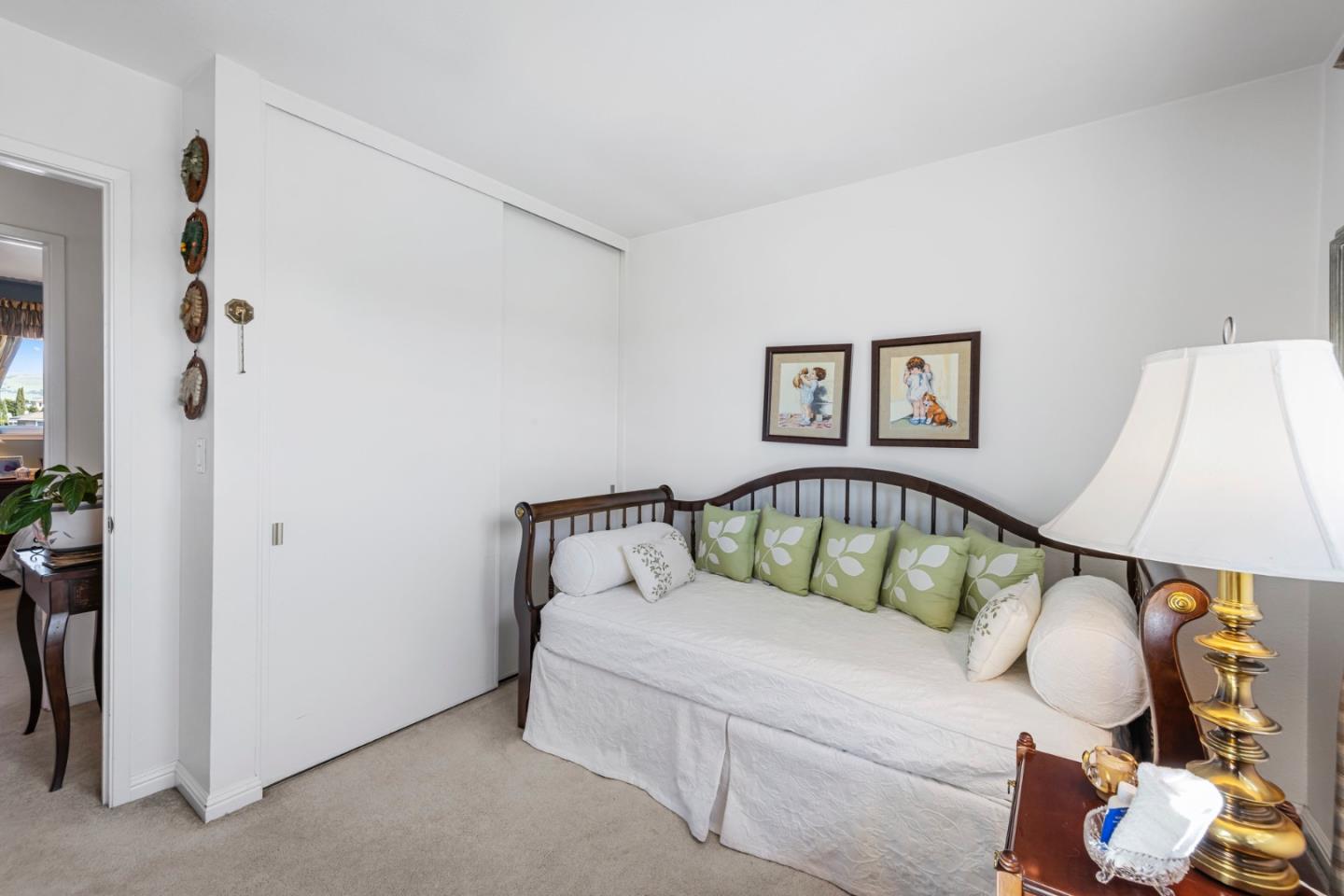 1272 Stardust Way Milpitas, CA 95035 - Photo 49 of 61 a white bed sitting in a bedroom next to a window
