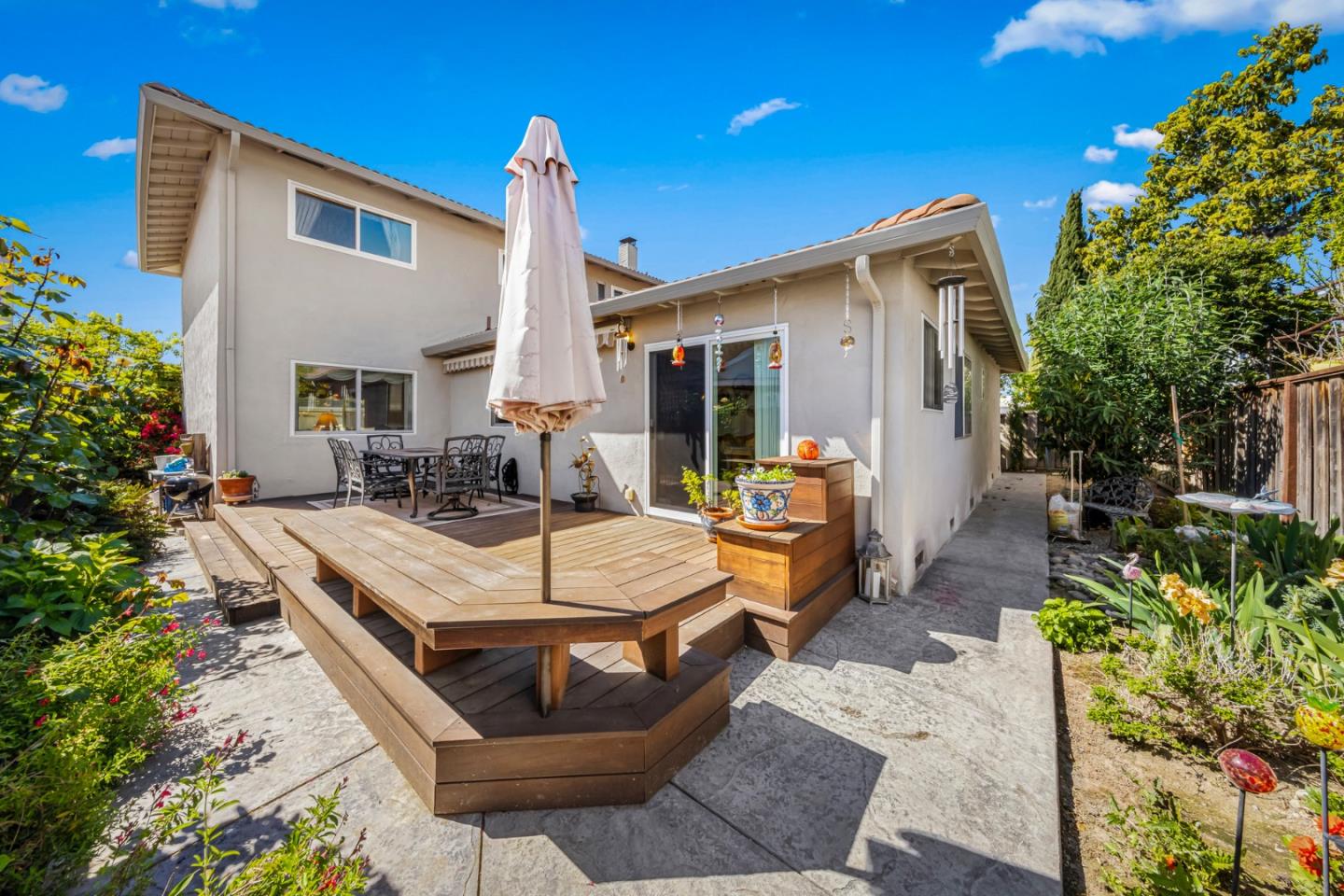 1272 Stardust Way Milpitas, CA 95035 - Photo 55 of 61 a view of a house with patio and a garden