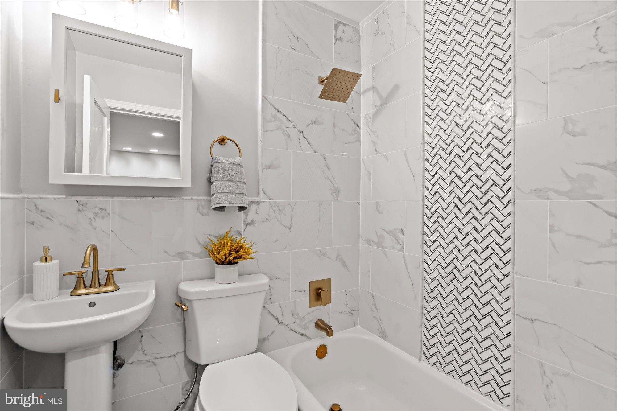 1241 18th Street Northeast, Unit 5 Washington, DC 20002 - Photo 14 of 17 a bathroom with a sink toilet and a mirror