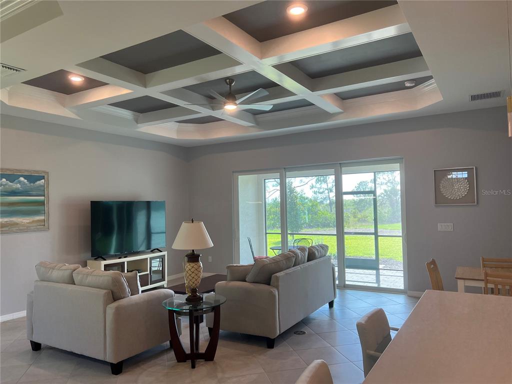 17535 Jadestone Court Venice, FL 34293 - Photo 15 of 92 a living room with furniture and a large window