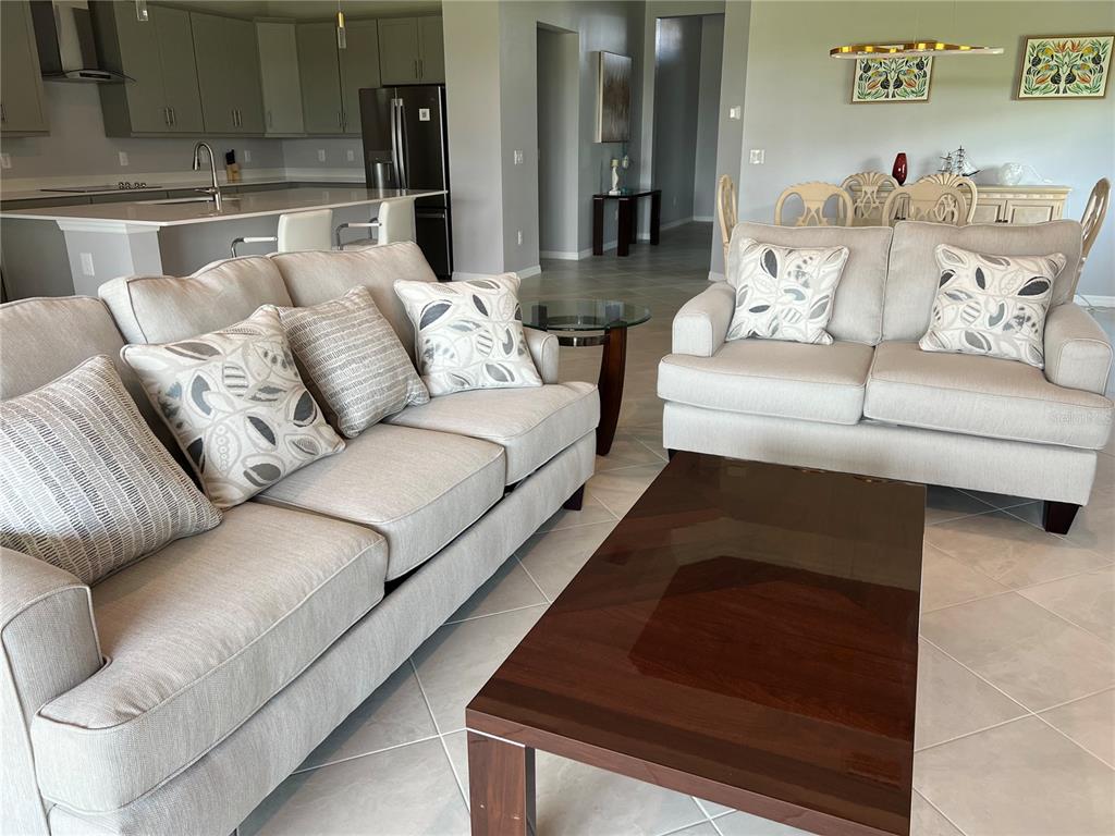 17535 Jadestone Court Venice, FL 34293 - Photo 18 of 92 a living room with furniture and a couch