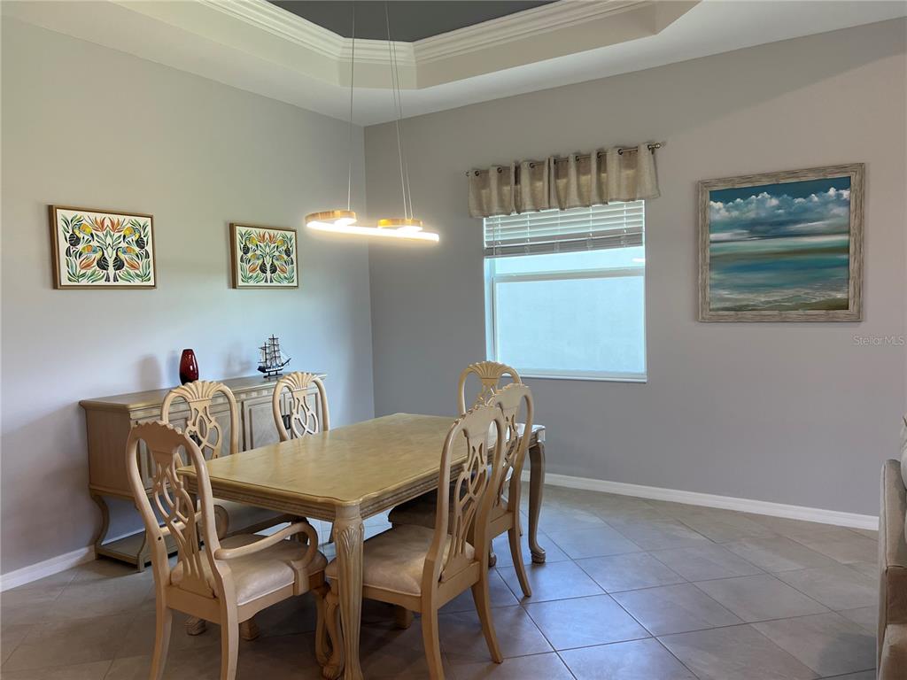 17535 Jadestone Court Venice, FL 34293 - Photo 19 of 92 a view of a dining room with furniture