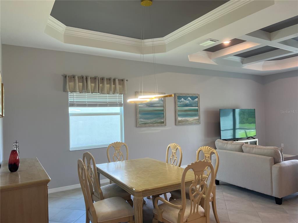 17535 Jadestone Court Venice, FL 34293 - Photo 20 of 92 a view of a dining room with furniture and window