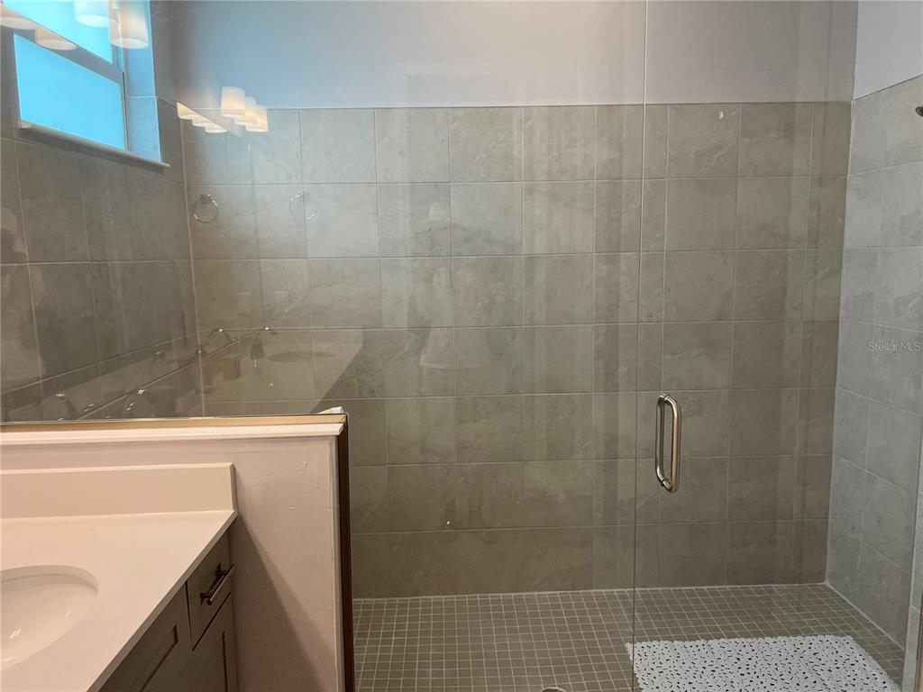 17535 Jadestone Court Venice, FL 34293 - Photo 31 of 92 a bathroom with a shower and a sink