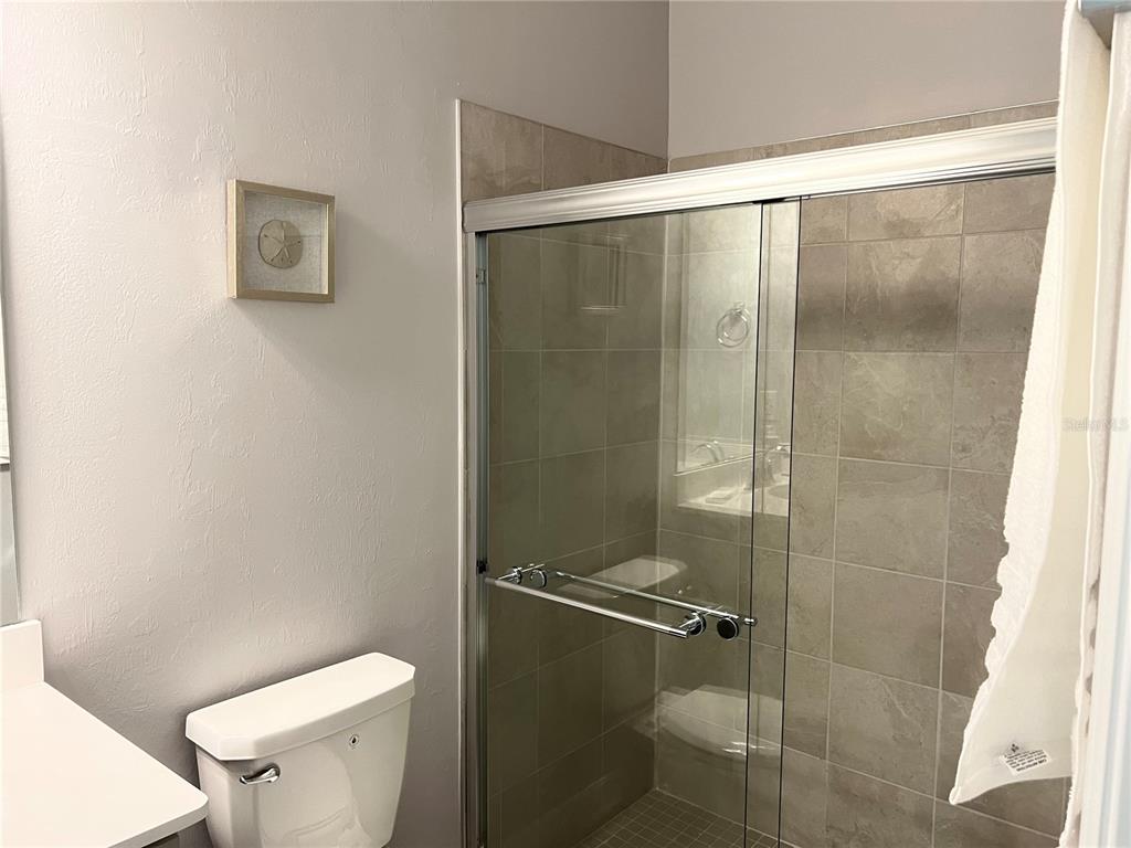 17535 Jadestone Court Venice, FL 34293 - Photo 38 of 92 a bathroom with a shower and a toilet