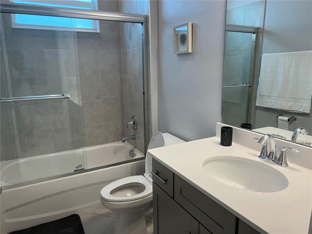 17535 Jadestone Court Venice, FL 34293 - Photo 41 of 92 a bathroom with a sink a toilet and a bathtub