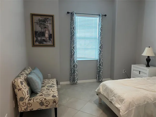 a kitchen with a table chairs and a flat screen tv