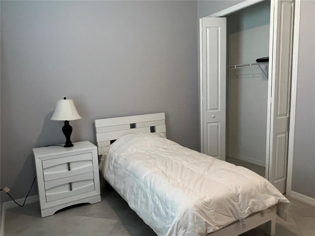 17535 Jadestone Court Venice, FL 34293 - Photo 46 of 92 a bedroom with a bed and a window