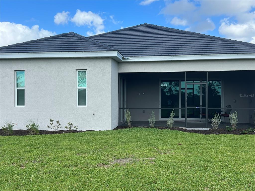17535 Jadestone Court Venice, FL 34293 - Photo 52 of 92 a front view of a house with garden