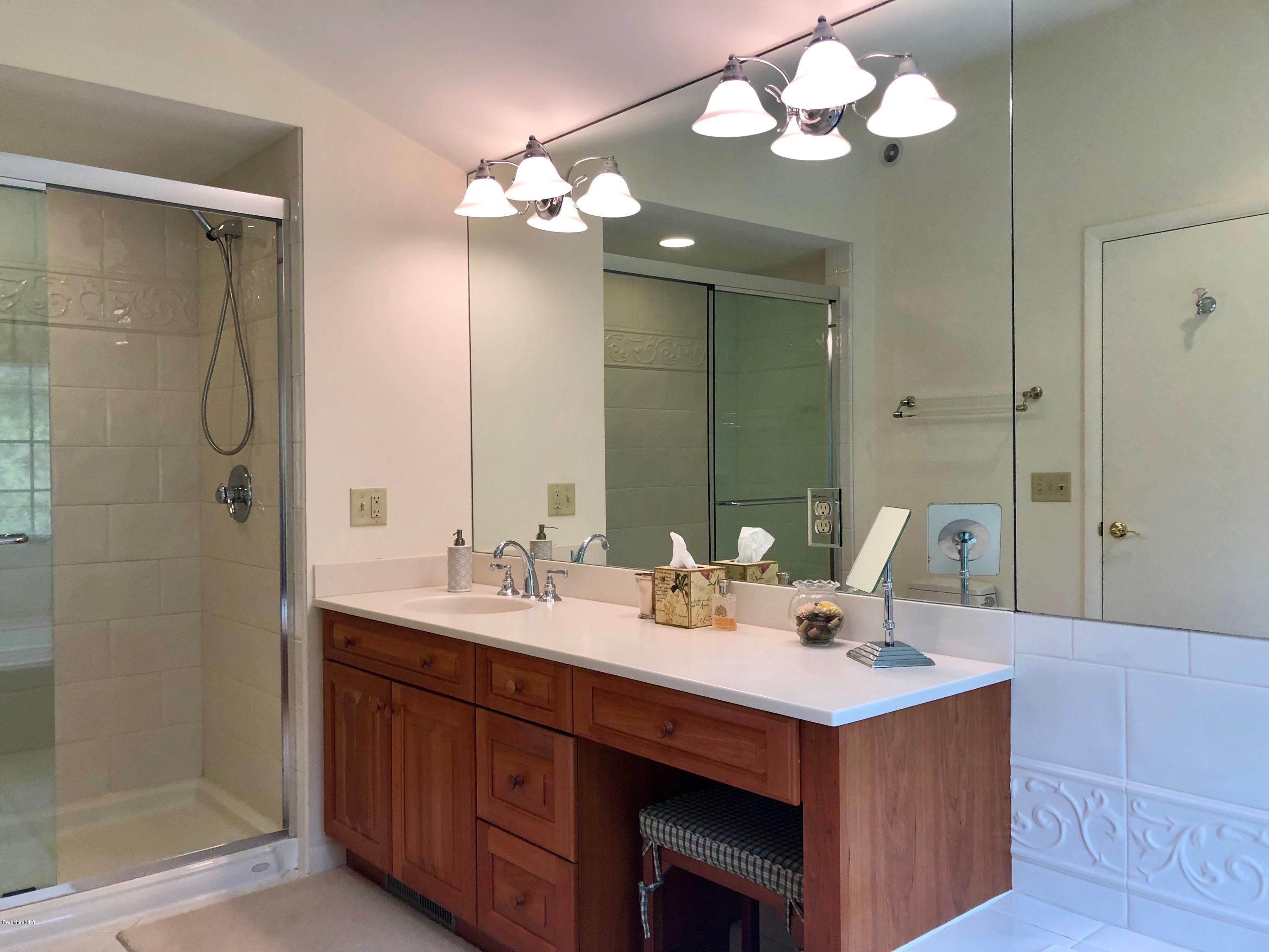 90 Lenox Road West Stockbridge, MA 01266 - Photo 17 of 23 a bathroom with a double vanity sink and a mirror