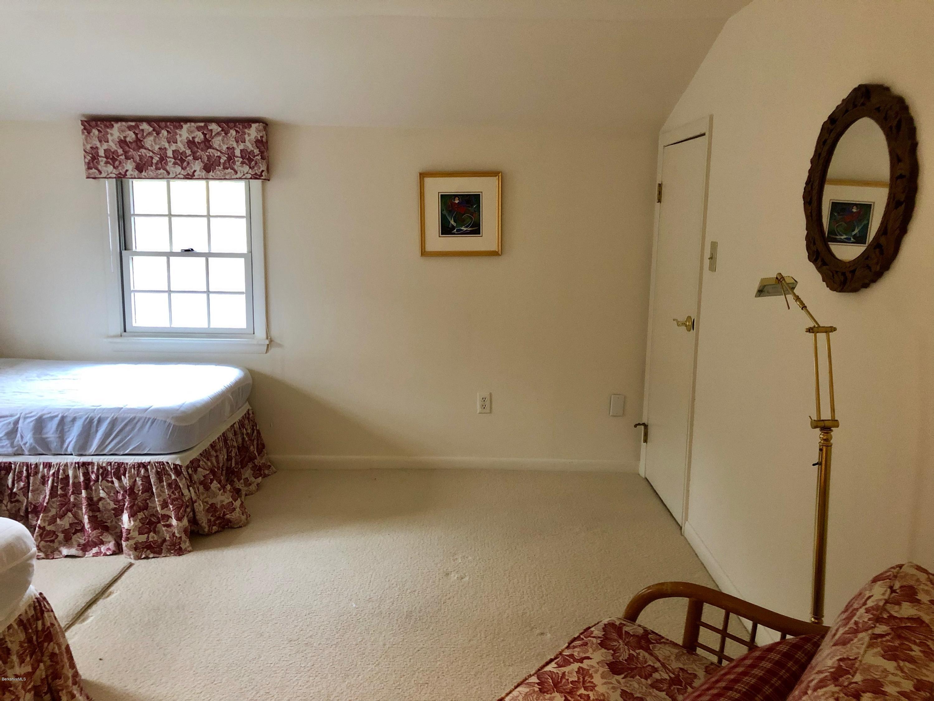 90 Lenox Road West Stockbridge, MA 01266 - Photo 19 of 23 a bedroom with a bed a mirror and windows
