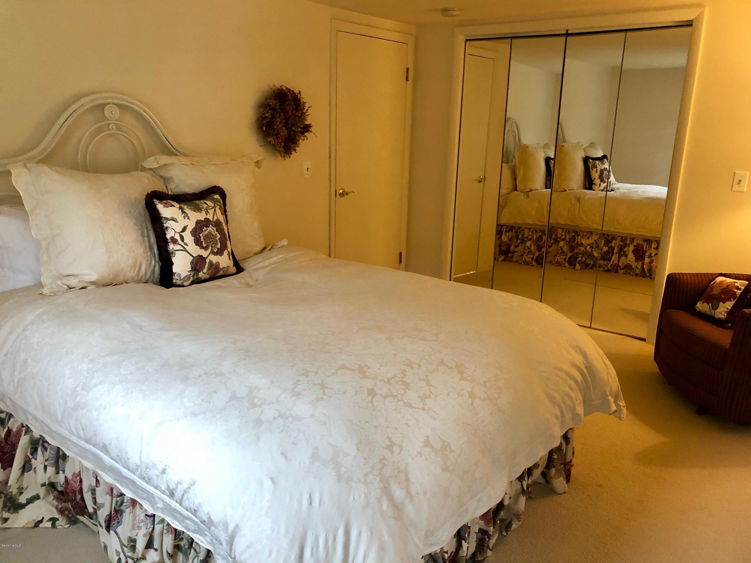 90 Lenox Road West Stockbridge, MA 01266 - Photo 21 of 23 a bedroom with a bed and a mirror