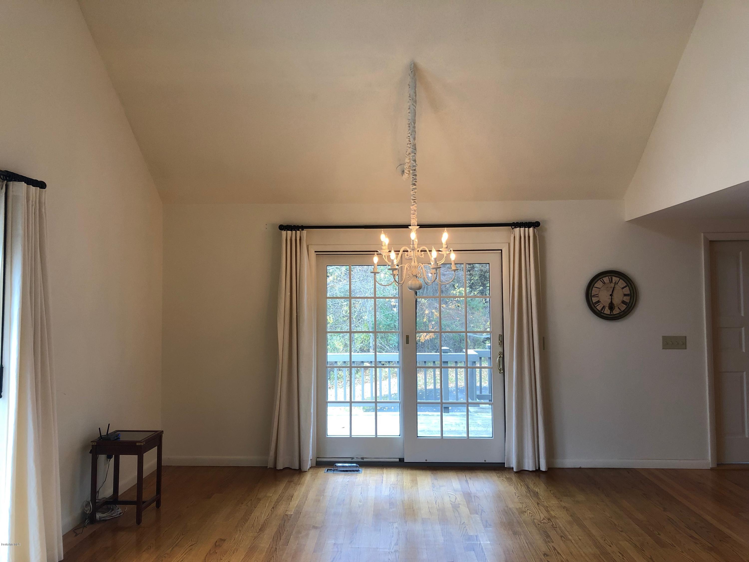 90 Lenox Road West Stockbridge, MA 01266 - Photo 10 of 23 a view of an empty room with wooden floor and a window