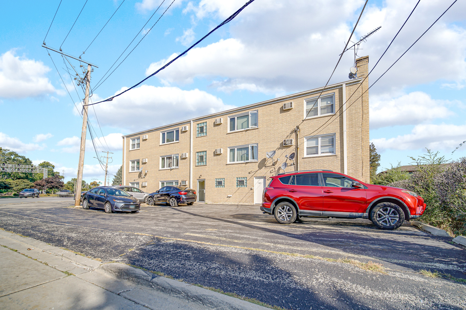 1211 Brown Street, Unit 3B Des Plaines, IL 60016 - Photo 13 of 14 a cars parked in front of a building