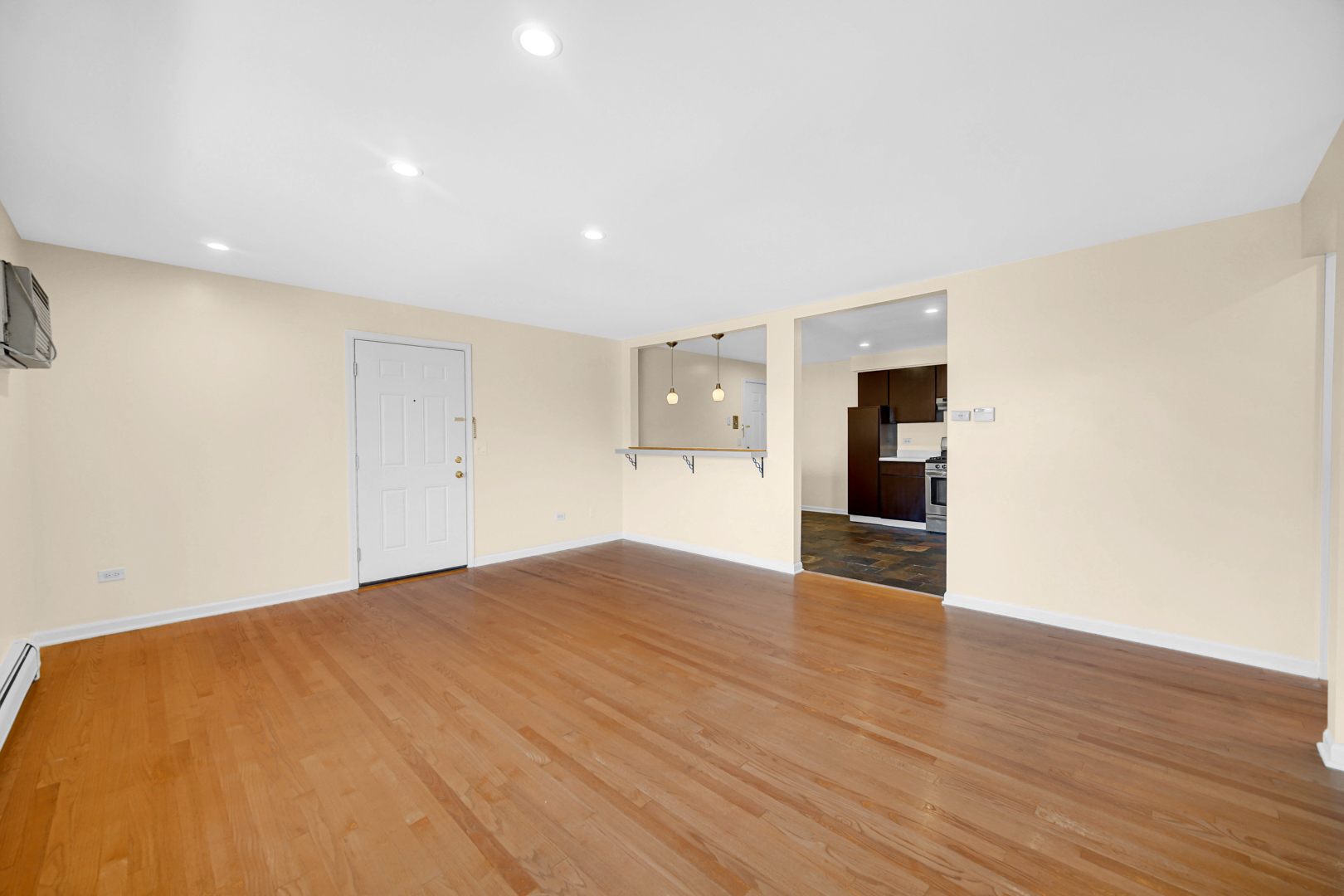 1211 Brown Street, Unit 3B Des Plaines, IL 60016 - Photo 4 of 14 a view of empty room with wooden floor