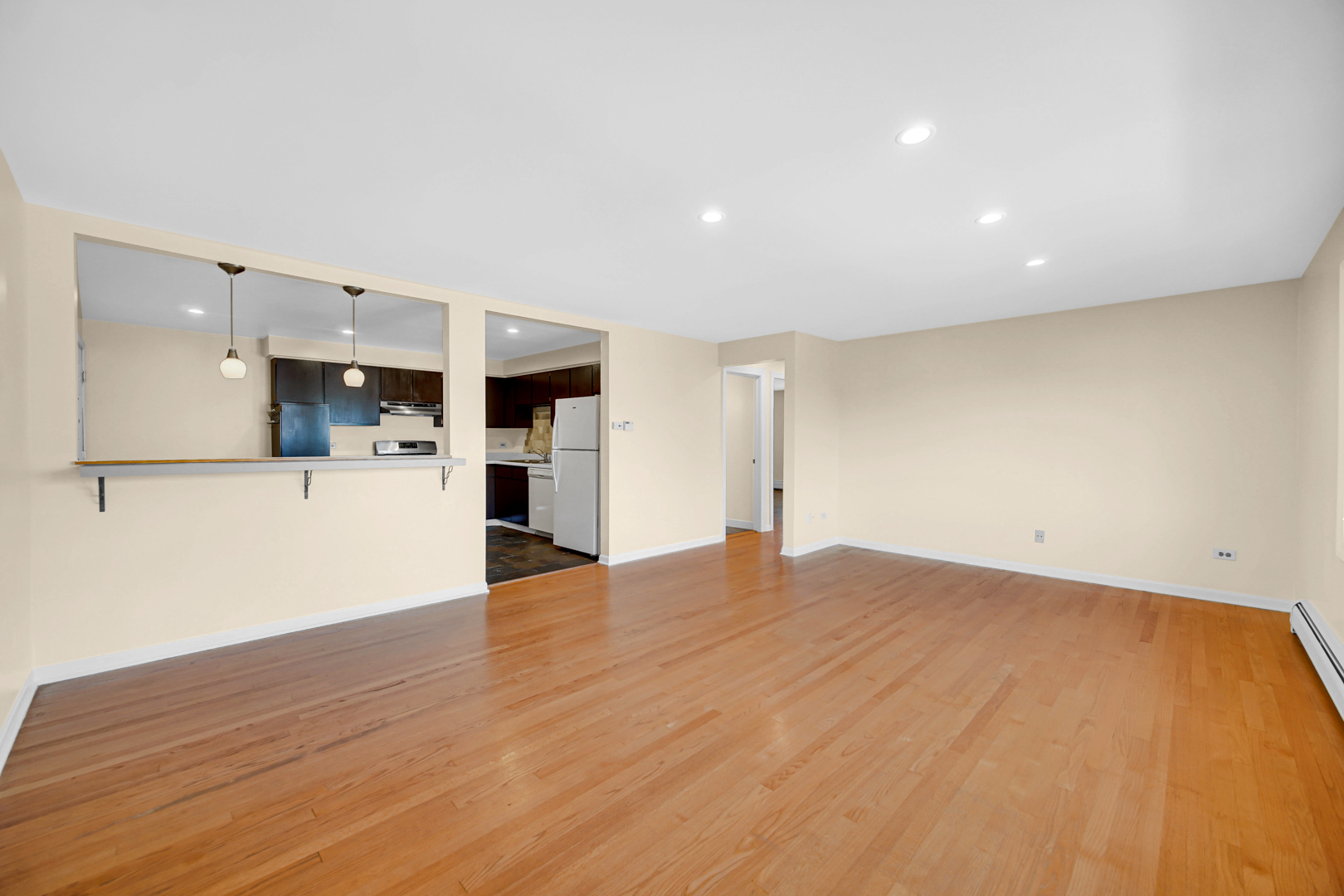 1211 Brown Street, Unit 3B Des Plaines, IL 60016 - Photo 5 of 14 a view of a kitchen with a sink and a refrigerator