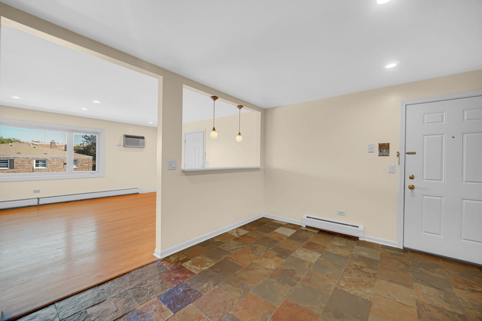 1211 Brown Street, Unit 3B Des Plaines, IL 60016 - Photo 7 of 14 a view of a kitchen with wooden floor and cabinets