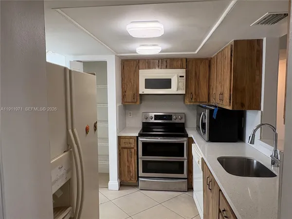 a kitchen with a stove and a sink