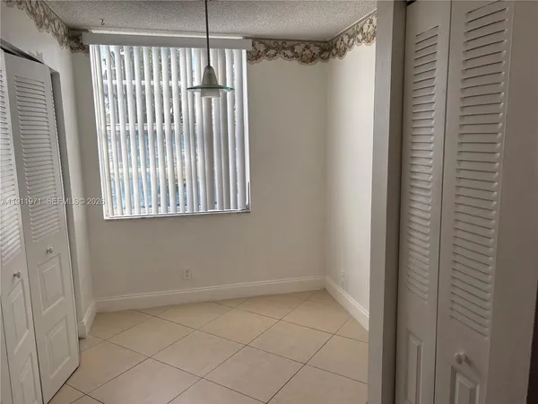 a view of a room that has a window in it