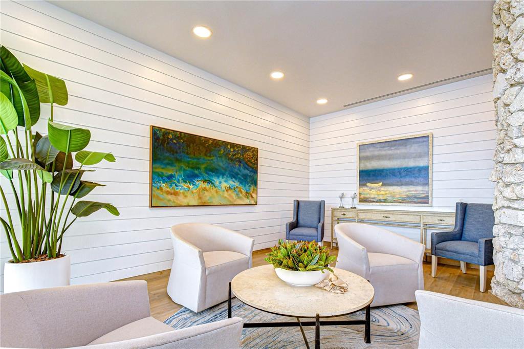 7100 Sunset Way, Unit 505 St. Pete Beach, FL 33706 - Photo 22 of 28 a living room with furniture and a potted plant