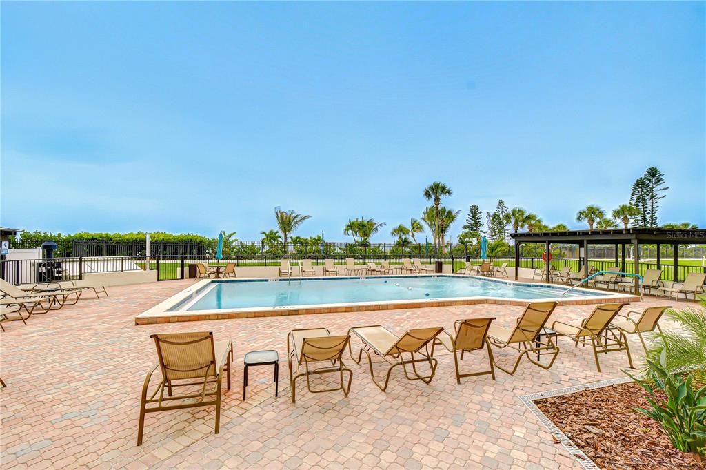 7100 Sunset Way, Unit 505 St. Pete Beach, FL 33706 - Photo 24 of 28 an outdoor space with seating space