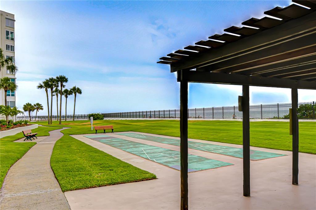 7100 Sunset Way, Unit 505 St. Pete Beach, FL 33706 - Photo 26 of 28 a view of yard with swimming pool