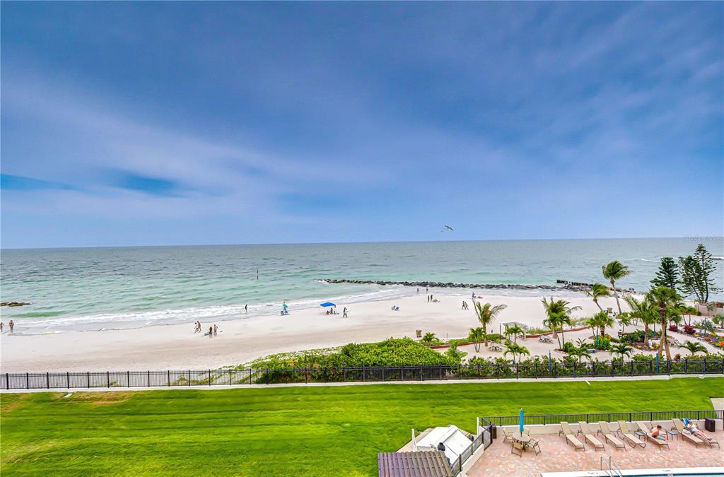 7100 Sunset Way, Unit 505 St. Pete Beach, FL 33706 - Photo 9 of 28 a view of a lake with a big yard