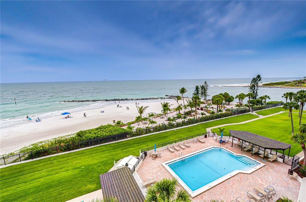 7100 Sunset Way, Unit 505 St. Pete Beach, FL 33706 - Photo 10 of 28 a view of an outdoor space and seating area