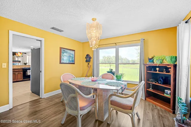 a kitchen with stainless steel appliances granite countertop wooden cabinets a sink and dishwasher a oven with large windows