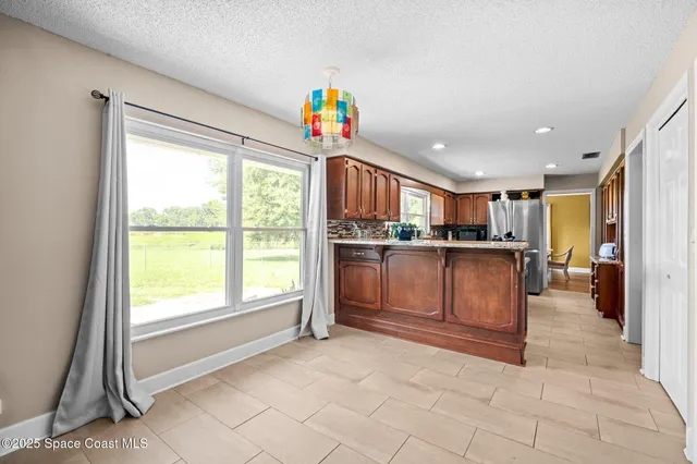 a living room with furniture wooden floor and a fireplace