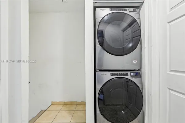 a view of a hallway with washer and dryer