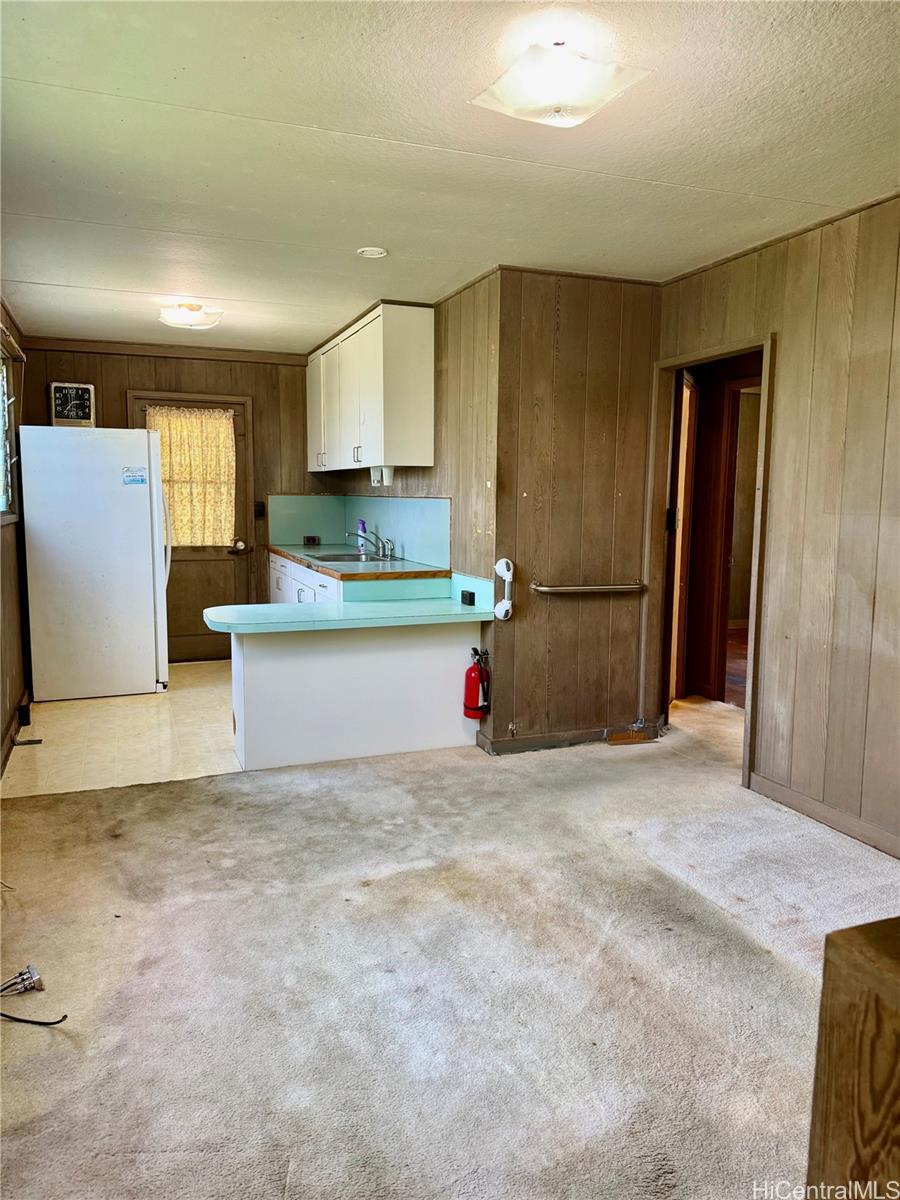 2816 Booth Road Honolulu, HI 96813 - Photo 12 of 17 a view of kitchen with stainless steel appliances granite countertop a refrigerator sink and cabinets