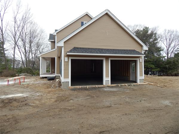 11 Checkerberry Lane Chelmsford, MA 01824 - Photo 3 of 10 a front view of a house with yard and trees in the background
