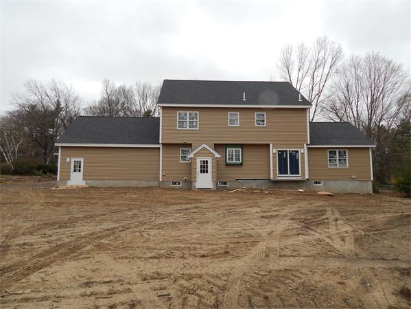 11 Checkerberry Lane Chelmsford, MA 01824 - Photo 5 of 10 a front view of a house with a yard