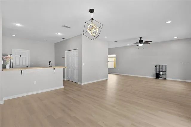 a view of a kitchen with a dishwasher and a refrigerator