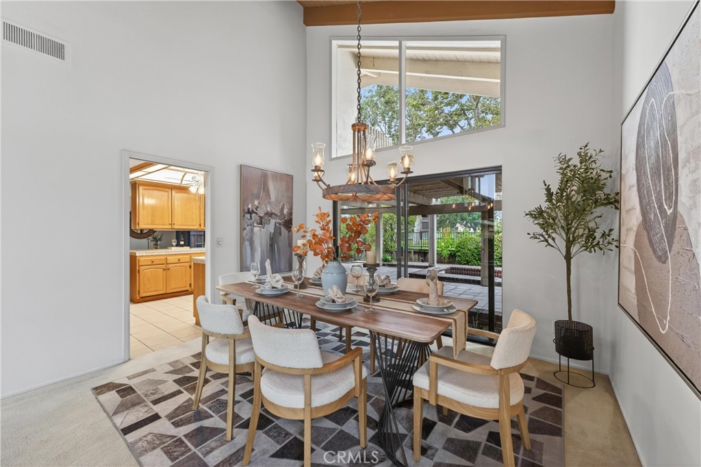 513 Pebble Beach Place Fullerton, CA 92835 - Photo 11 of 42 a dining room with furniture and a large window
