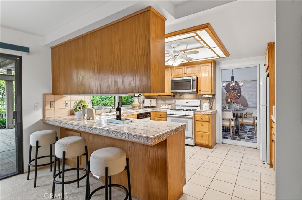 513 Pebble Beach Place Fullerton, CA 92835 - Photo 12 of 42 a kitchen with a sink cabinets and window