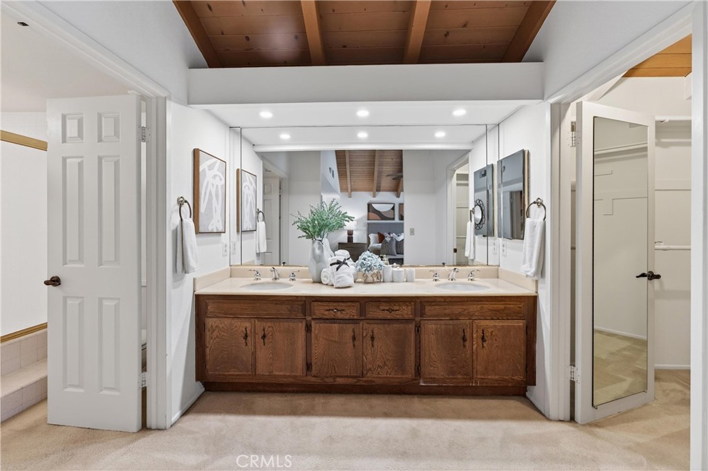 513 Pebble Beach Place Fullerton, CA 92835 - Photo 20 of 42 a bathroom with a double vanity sink mirror and