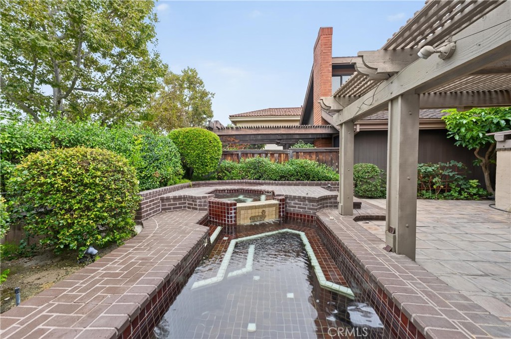 513 Pebble Beach Place Fullerton, CA 92835 - Photo 27 of 42 a view of a house with pool and chairs