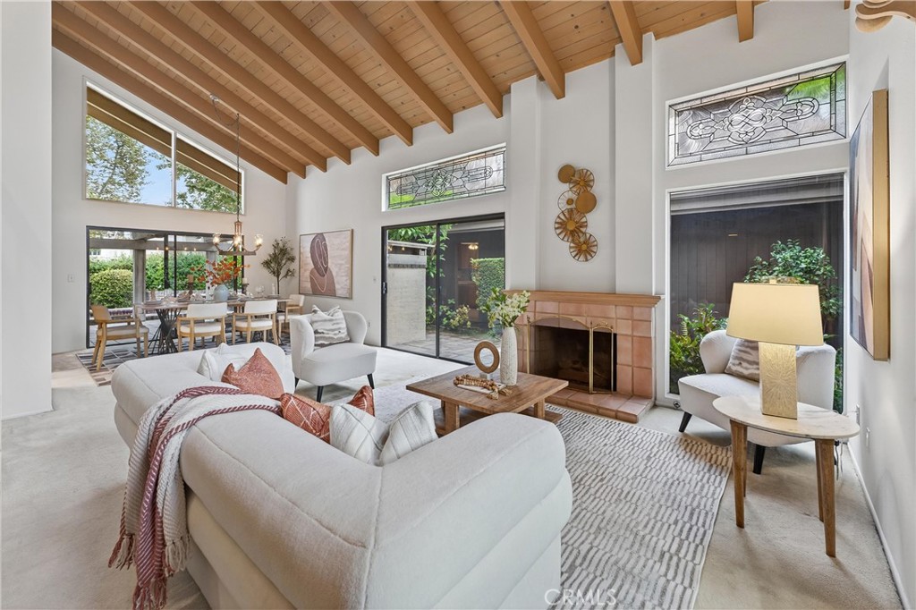513 Pebble Beach Place Fullerton, CA 92835 - Photo 3 of 42 a living room with furniture large window and a fireplace