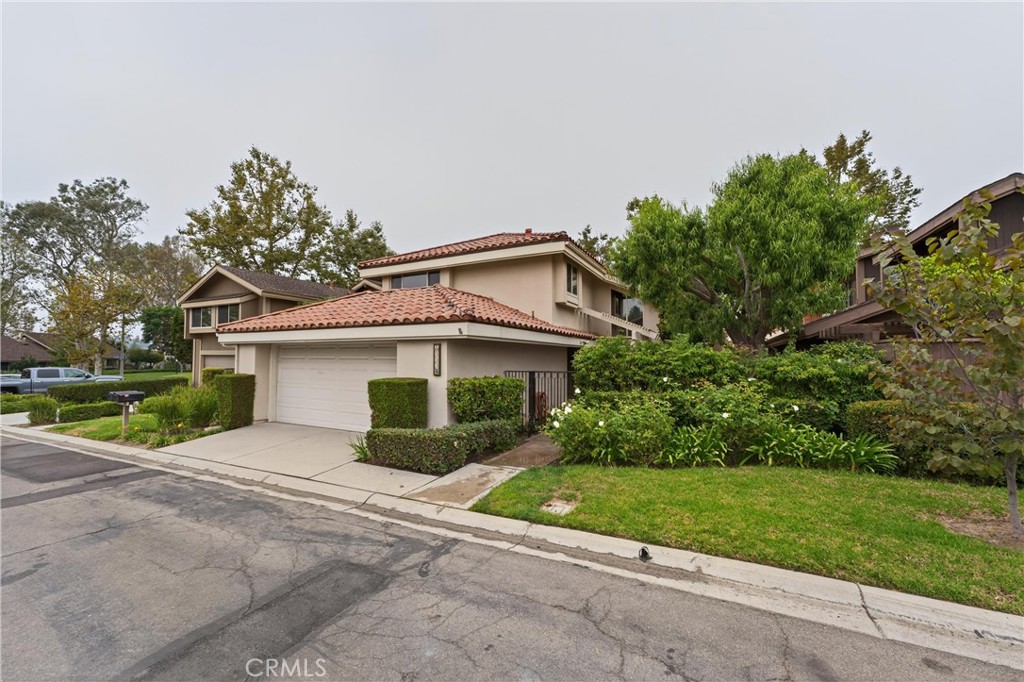 513 Pebble Beach Place Fullerton, CA 92835 - Photo 40 of 42 front view of a house with a small yard