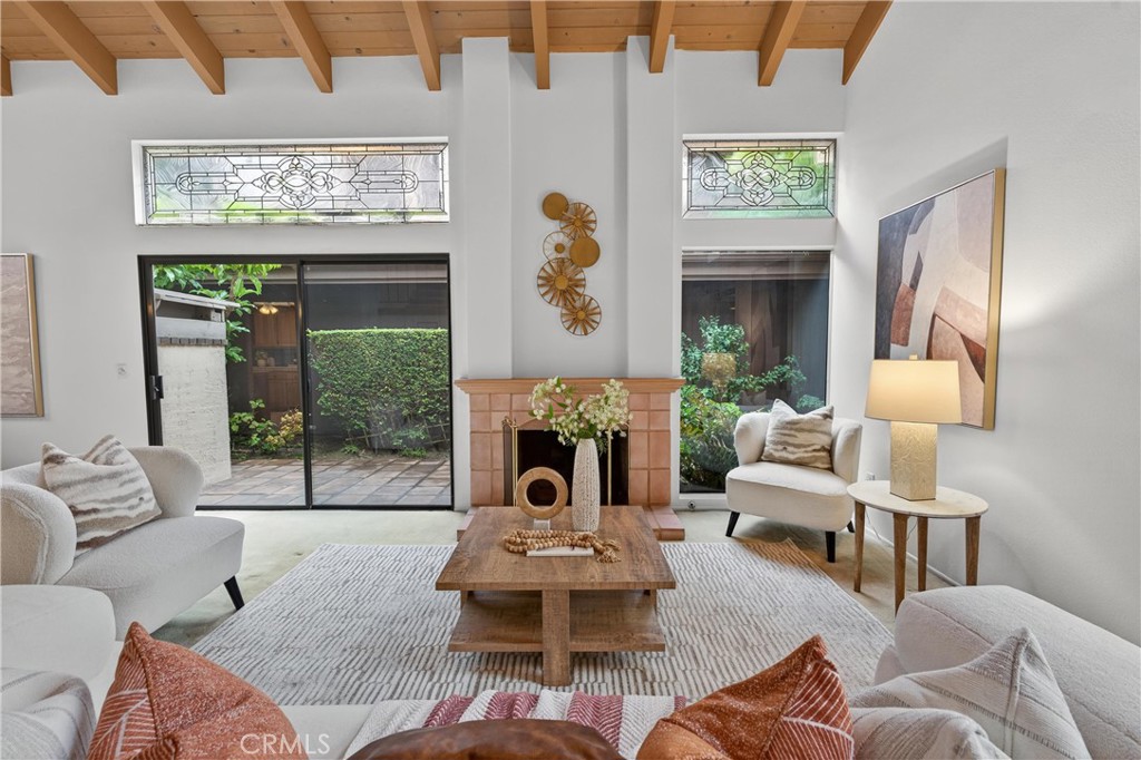513 Pebble Beach Place Fullerton, CA 92835 - Photo 4 of 42 a living room with furniture fireplace and a large window