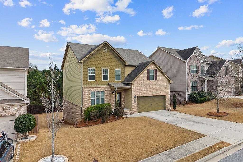 2415 Matlin Way Buford, GA 30519 - Photo 2 of 66 a front view of a house with a yard