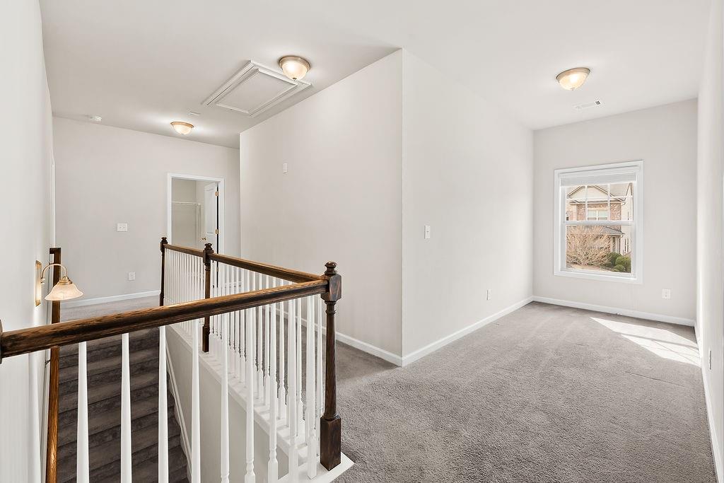 2415 Matlin Way Buford, GA 30519 - Photo 38 of 66 a view of hallway with stairs