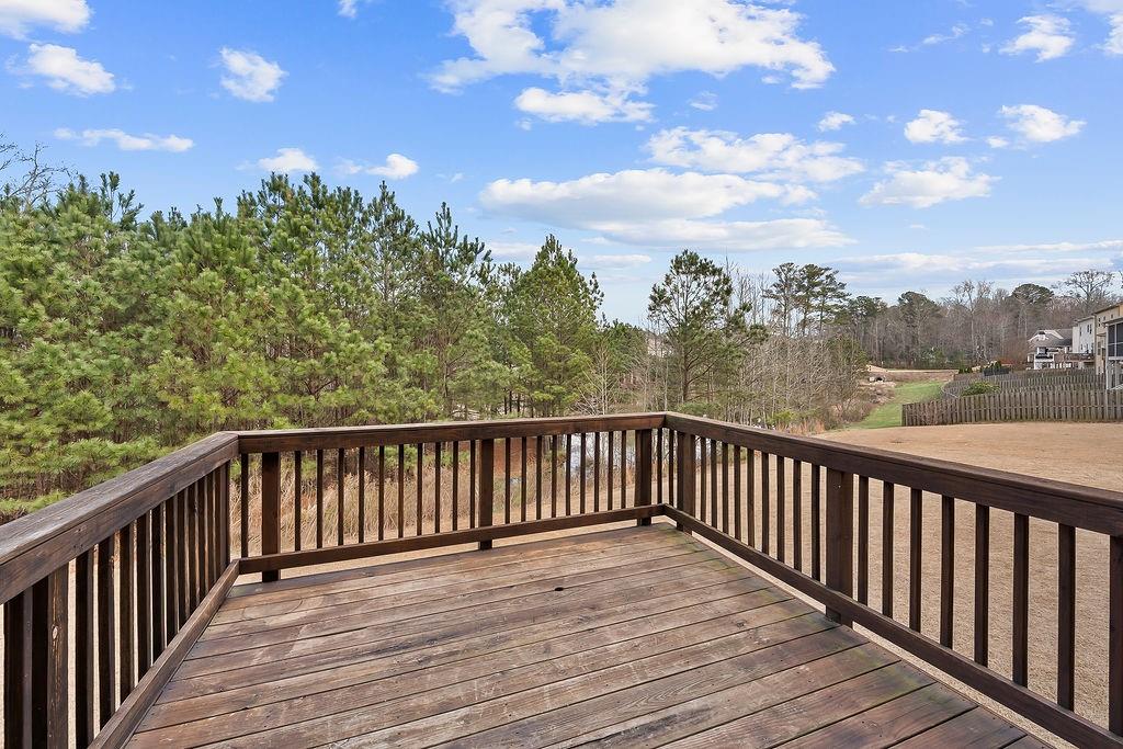 2415 Matlin Way Buford, GA 30519 - Photo 52 of 66 a view of a balcony with wooden fence